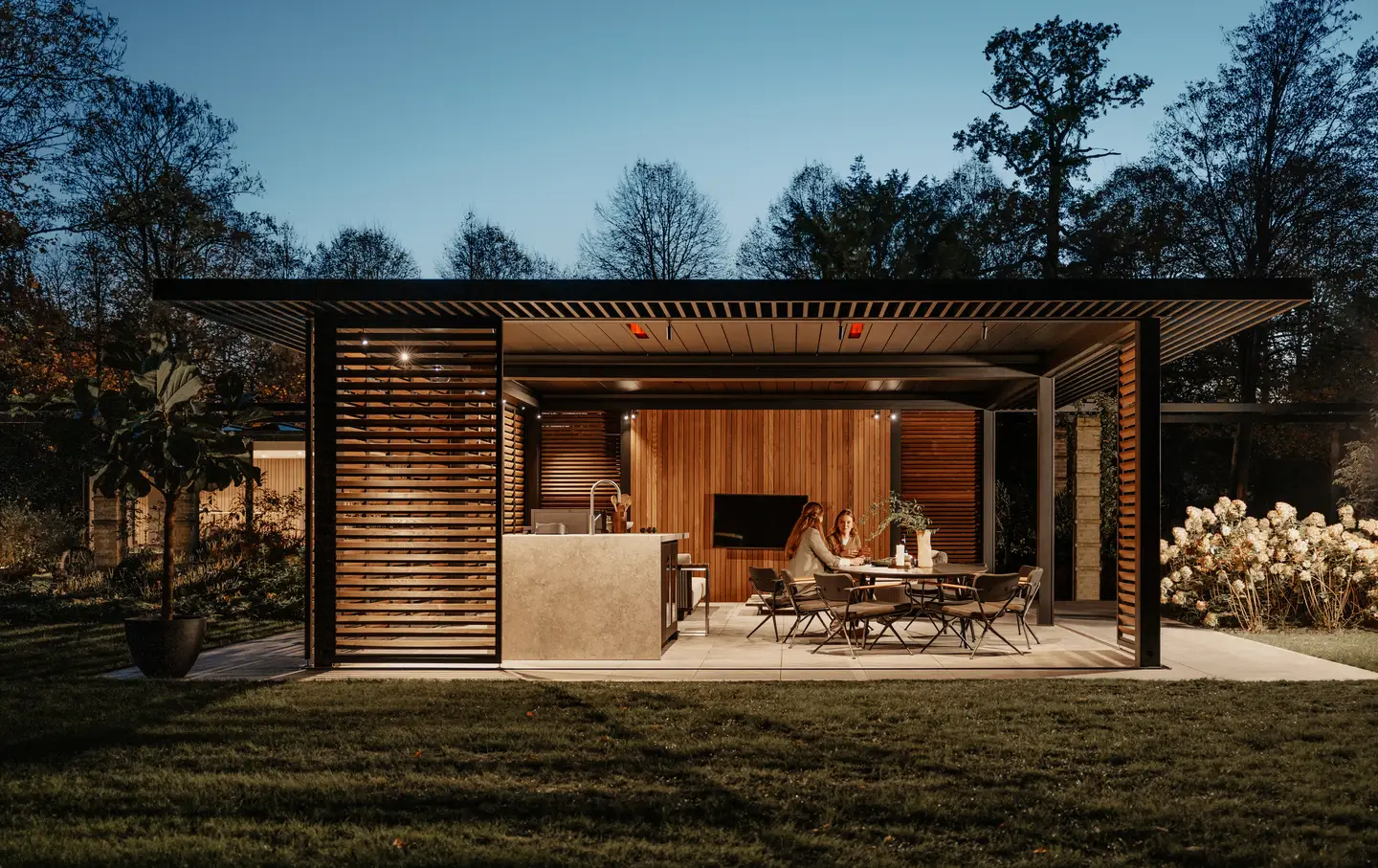 Amani outdoor lounge with integrated Lineo Heat pergola lighting