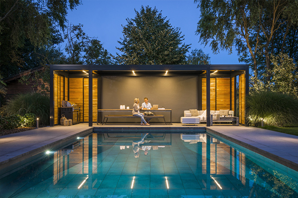 Freestanding pergola creating a poolside lounge